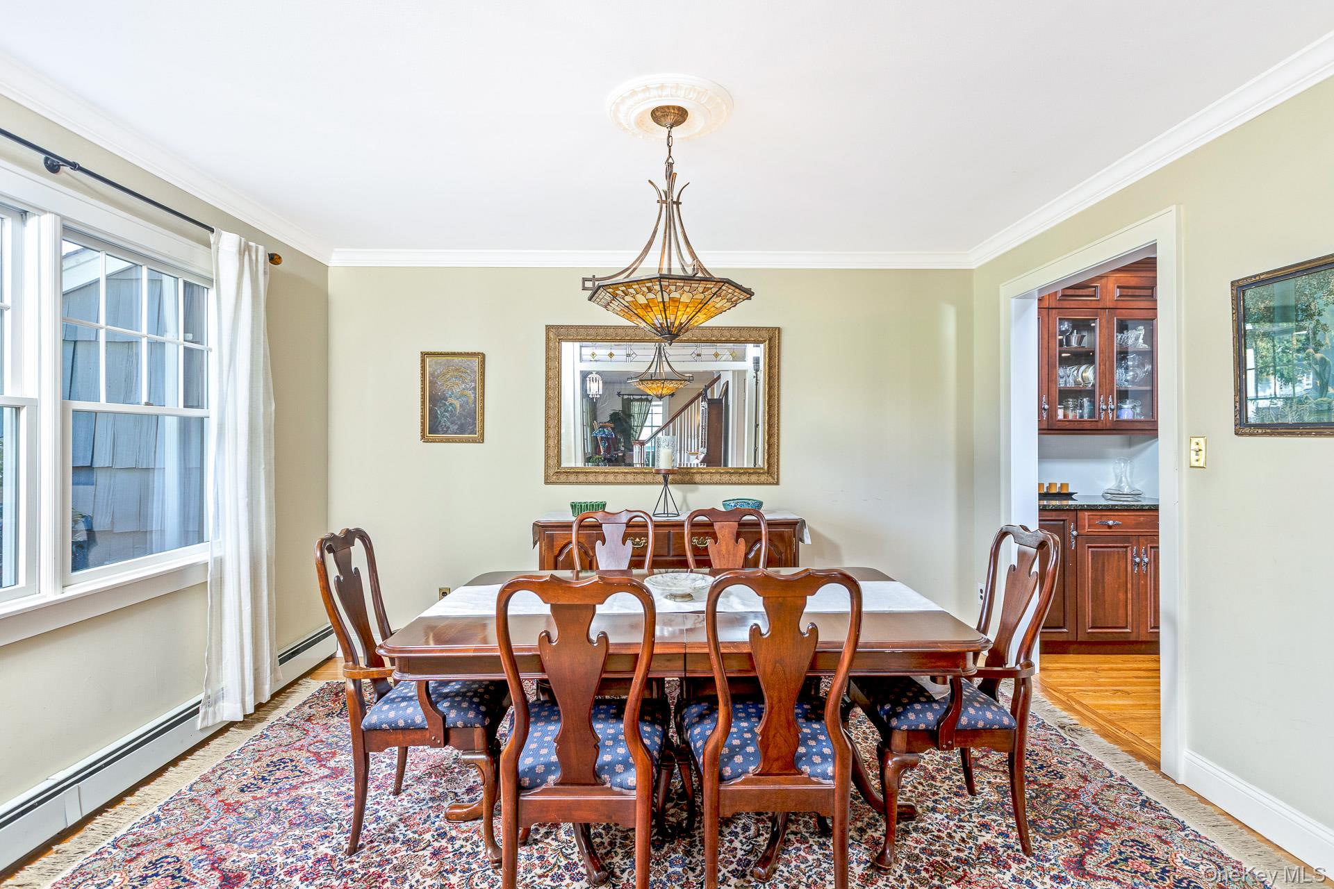 7 Shipyard Lane Setauket, NY 11733 - Photo 8 of 32 a dining room with furniture a chandelier and window