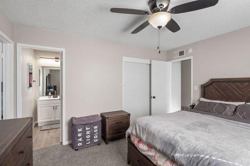 1833 Jenner Street Lancaster, CA 93534 - Photo 16 of 31 a bedroom with a bed and a chandelier