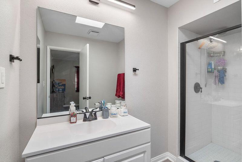 1833 Jenner Street Lancaster, CA 93534 - Photo 18 of 31 a bathroom with a sink vanity mirror and tub