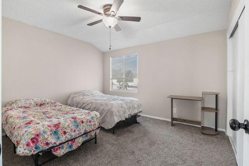 1833 Jenner Street Lancaster, CA 93534 - Photo 26 of 31 a bedroom with two beds and a desk