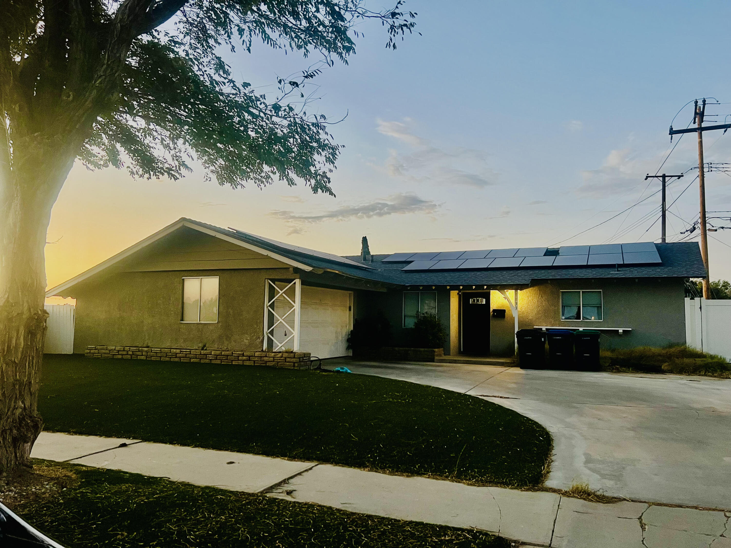1833 Jenner Street Lancaster, CA 93534 - Photo 6 of 31 a front view of a house with a yard and garage