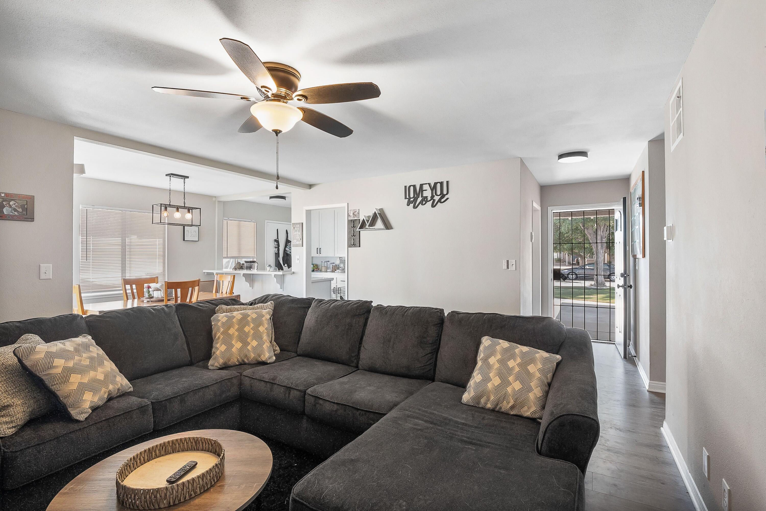 1833 Jenner Street Lancaster, CA 93534 - Photo 8 of 31 a living room with furniture and a ceiling fan
