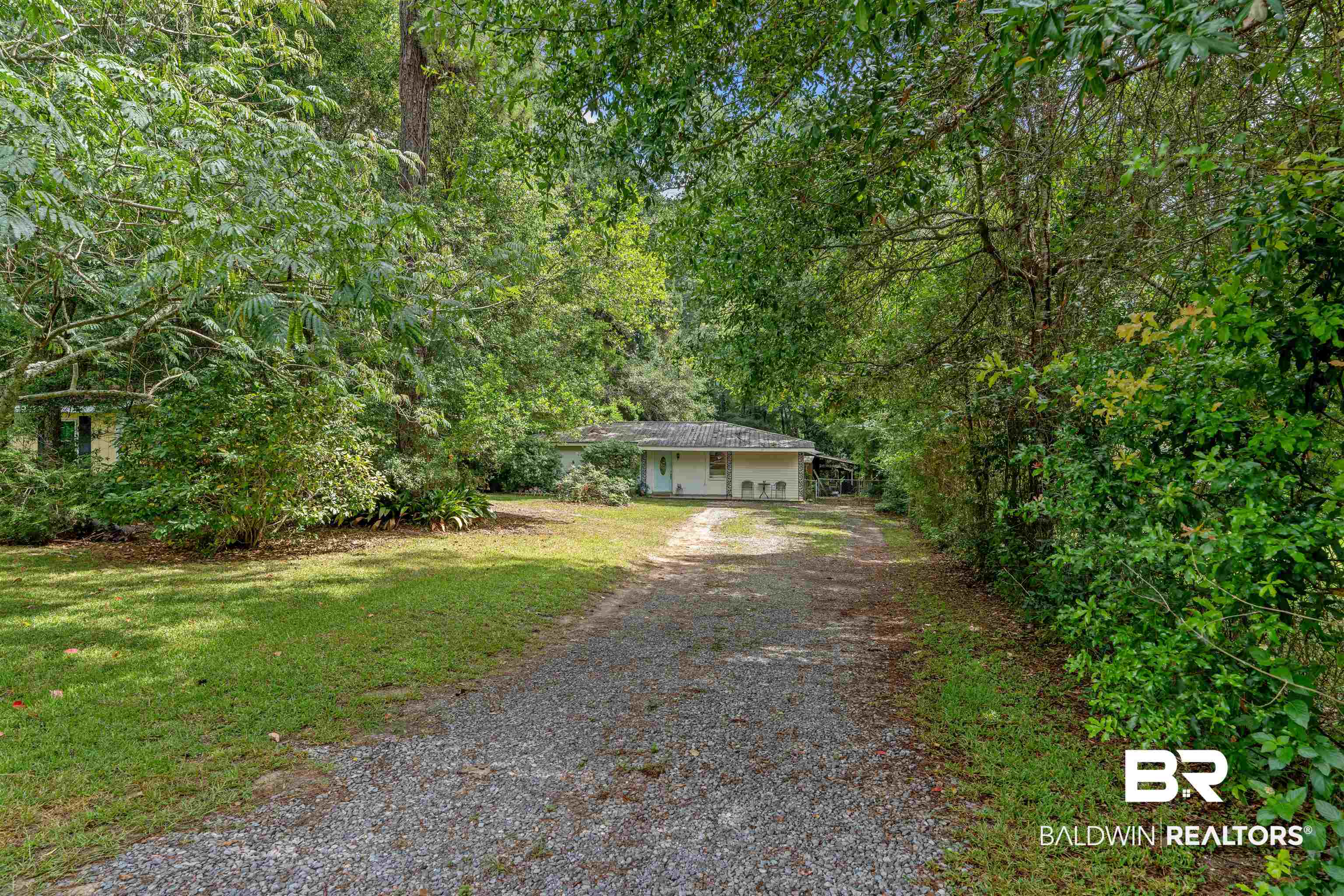 922 Dauphine Circle Daphne, AL 36526 - Photo 26 of 29 View of front of home featuring driveway, a front yard, and a wooded view