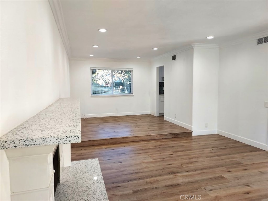 8803 Hummingbird Avenue Fountain Valley, CA 92708 - Photo 11 of 43 an empty room with wooden floor and window