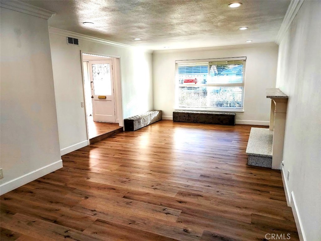 8803 Hummingbird Avenue Fountain Valley, CA 92708 - Photo 12 of 43 a view of a room with wooden floor and window