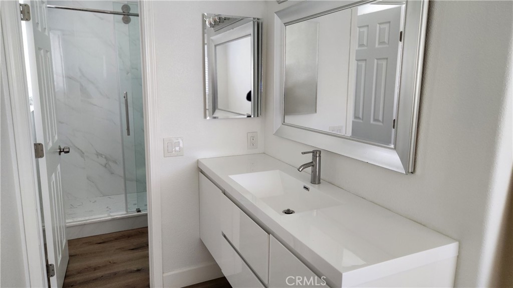 8803 Hummingbird Avenue Fountain Valley, CA 92708 - Photo 13 of 43 a bathroom with a sink and mirror