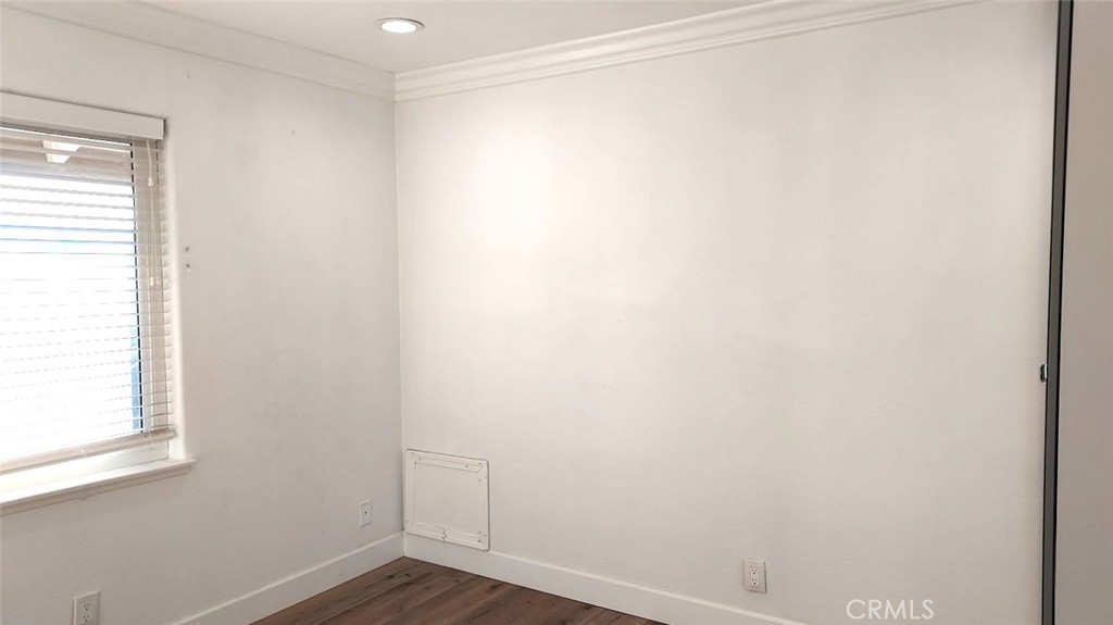 8803 Hummingbird Avenue Fountain Valley, CA 92708 - Photo 16 of 43 a view of a small space with wooden floor and a window