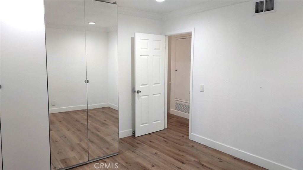 8803 Hummingbird Avenue Fountain Valley, CA 92708 - Photo 17 of 43 a view of room with hardwood floor