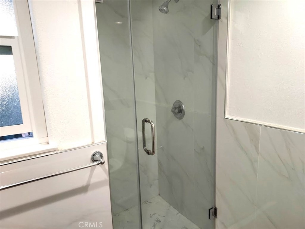 8803 Hummingbird Avenue Fountain Valley, CA 92708 - Photo 27 of 43 a bathroom with a shower