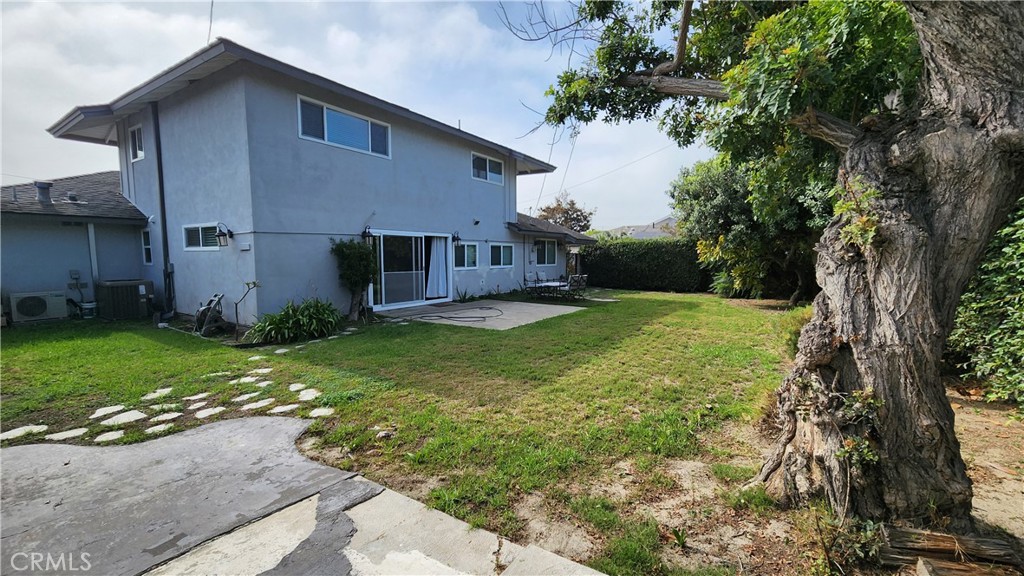 8803 Hummingbird Avenue Fountain Valley, CA 92708 - Photo 37 of 43 a view of a house with backyard and garden
