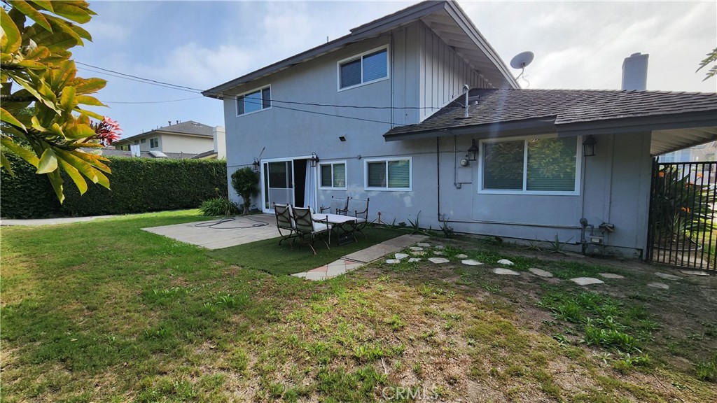 8803 Hummingbird Avenue Fountain Valley, CA 92708 - Photo 38 of 43 a view of a house with a yard patio and a fountain