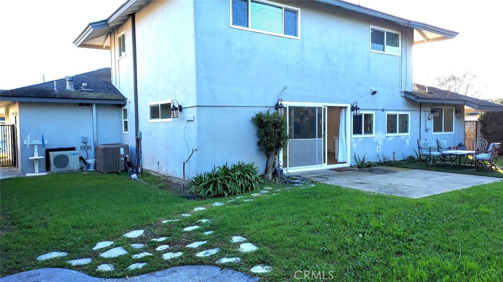 8803 Hummingbird Avenue Fountain Valley, CA 92708 - Photo 42 of 43 a view of backyard with potted plants and wooden fence