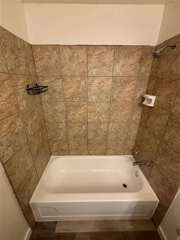 a bathroom with a bath tub