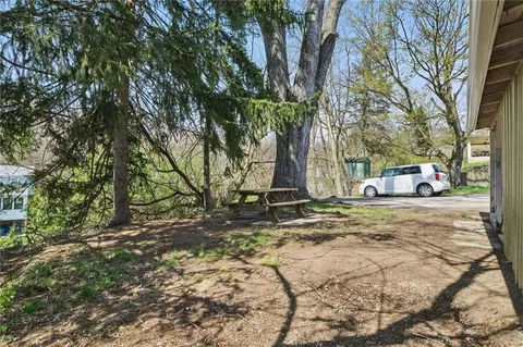 a backyard of a house with trees