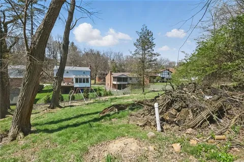 a backyard of a house with lots of green space
