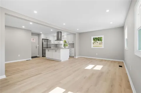 a view of a kitchen with a sink and a window