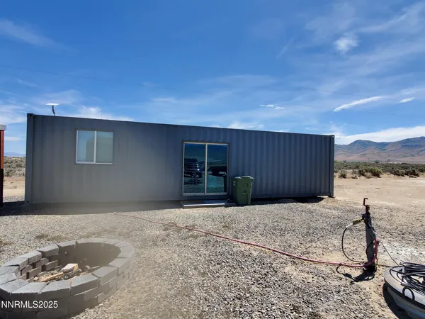 a view of a house with backyard of house