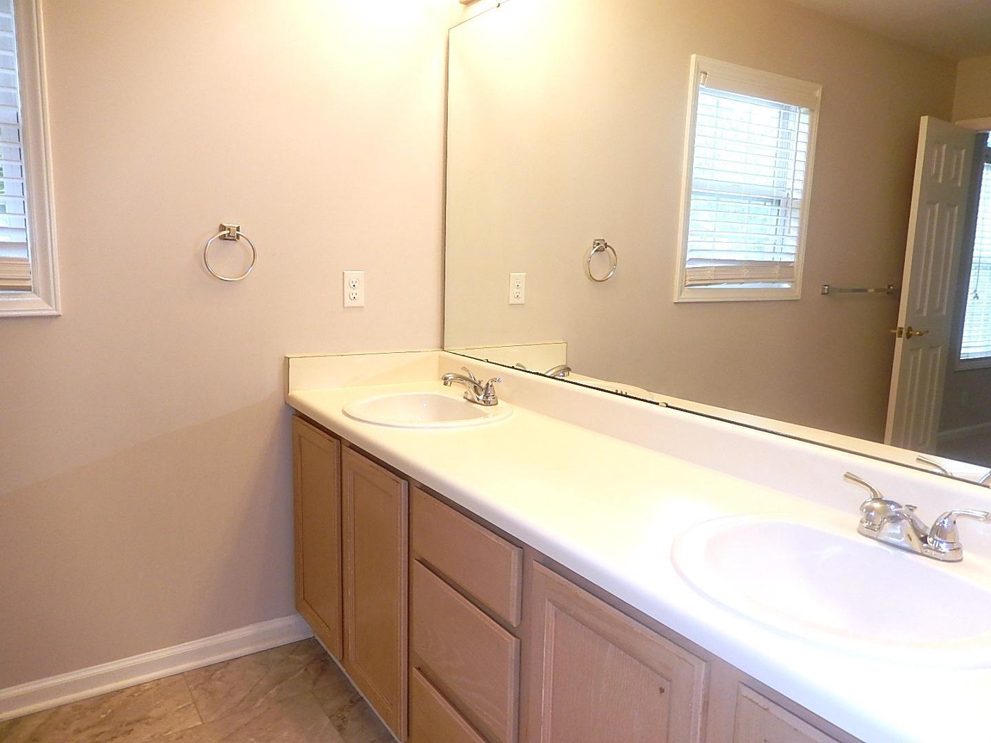 211 Bridgepath Drive Cary, NC 27513 - Photo 18 of 26 a bathroom with a sink and a mirror