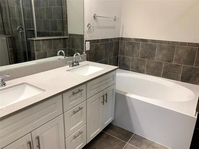 a bathroom with a sink and a bathtub