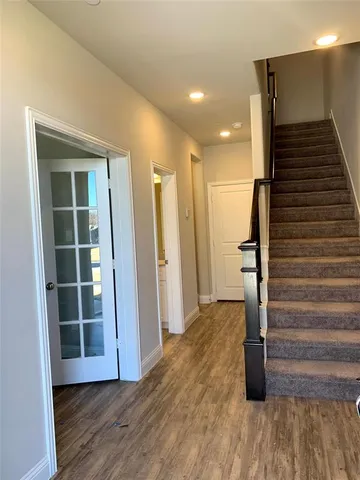a view of entryway with wooden floor