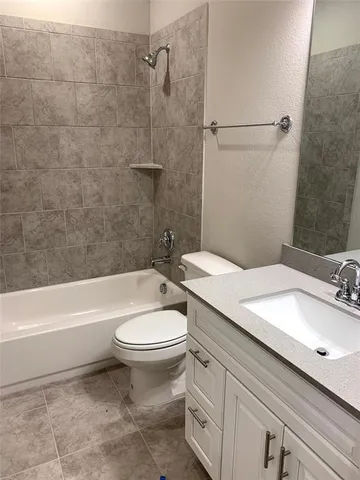 a bathroom with a sink a toilet and a bathtub