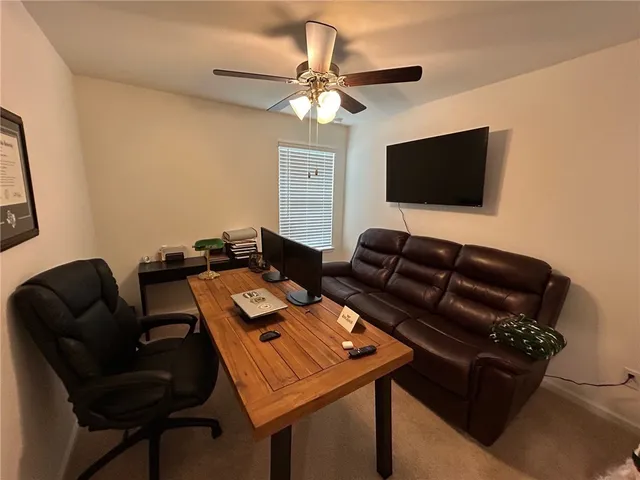 a bathroom with a granite countertop sink a toilet and shower