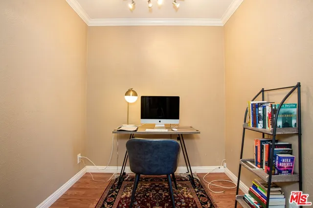 a room with bookshelf and a window