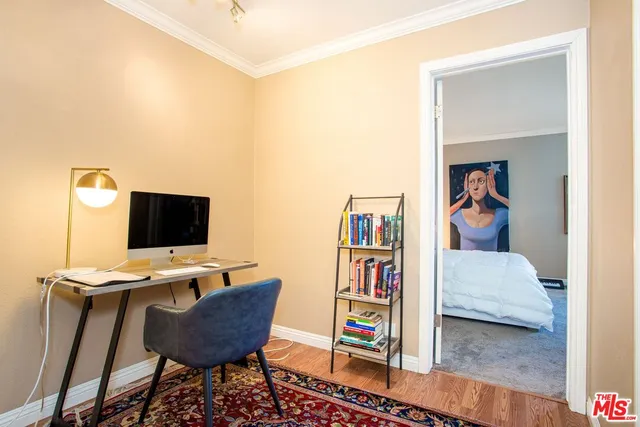 a workspace with furniture and book shelf