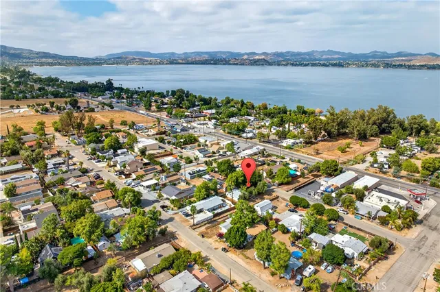 a view of a porch with furniture and a backyard