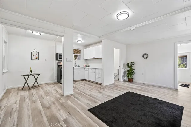 a view of kitchen with furniture and wooden floor