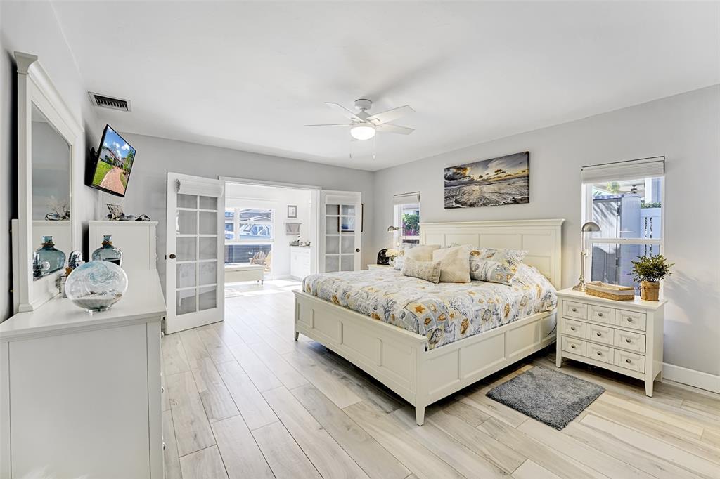 2524 Southeast 9th Street Pompano Beach, FL 33062 - Photo 11 of 45 a spacious bedroom with a bed and a cabinets