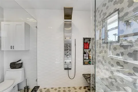 a outdoor living with dining table and a large window