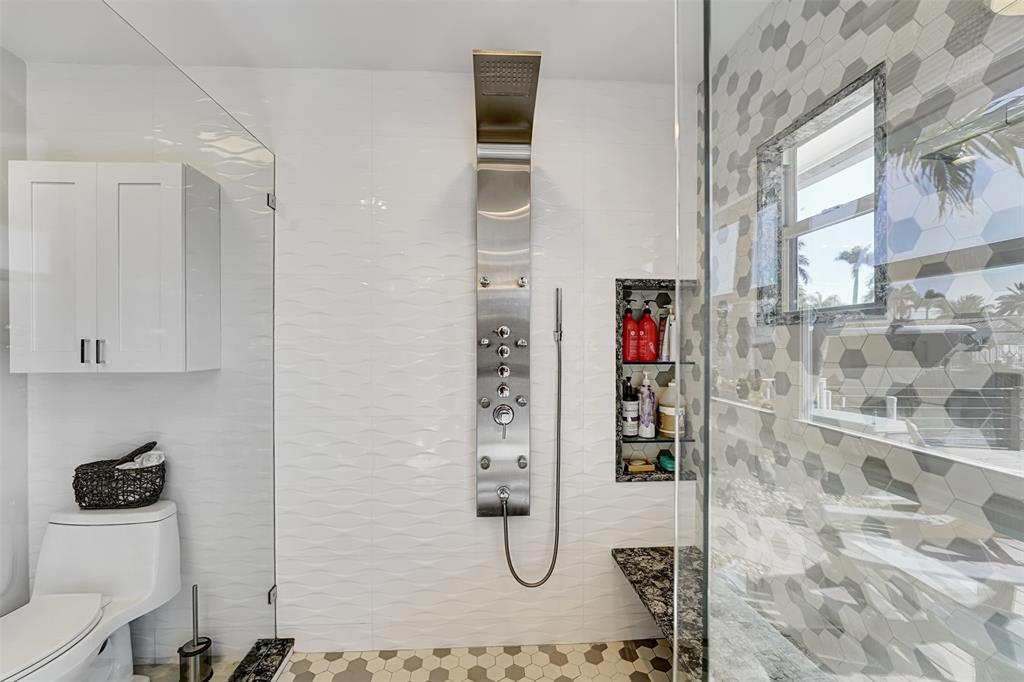 2524 Southeast 9th Street Pompano Beach, FL 33062 - Photo 19 of 45 a bathroom with a granite countertop shower