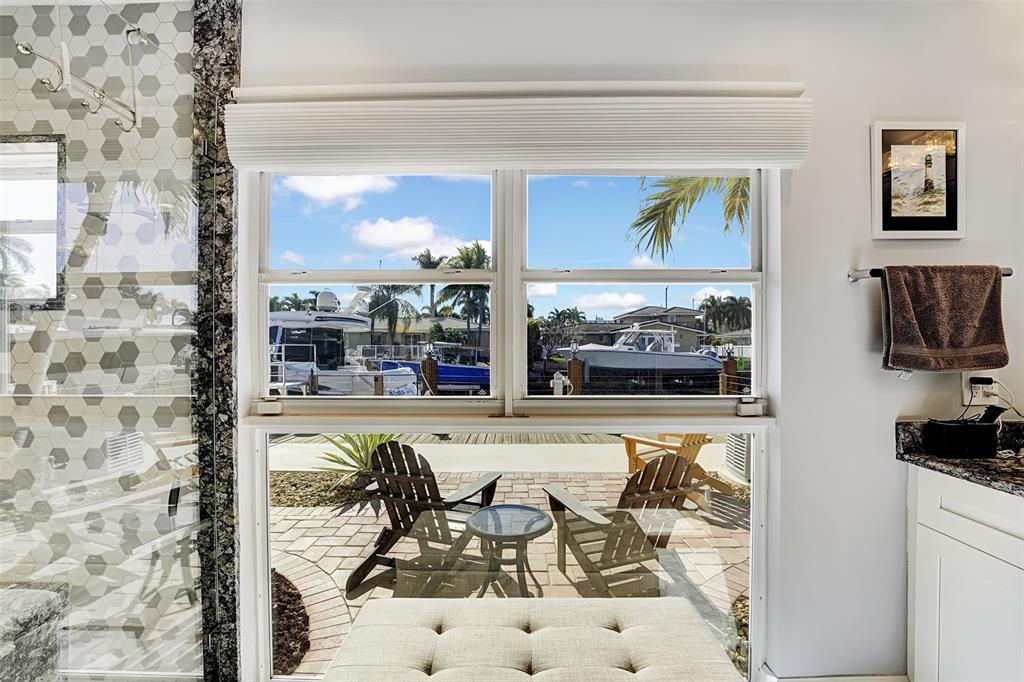 2524 Southeast 9th Street Pompano Beach, FL 33062 - Photo 20 of 45 a outdoor living with dining table and a large window