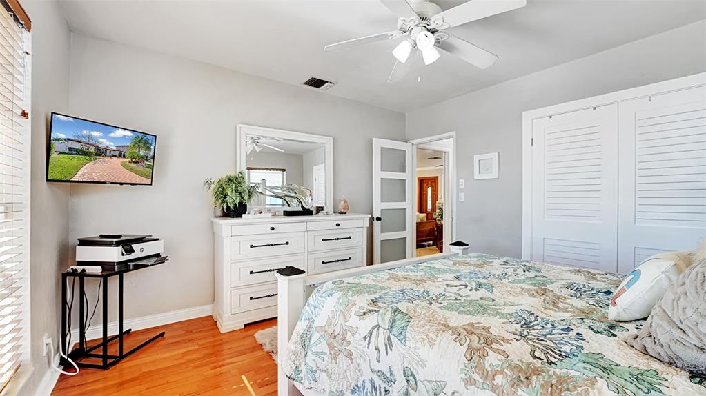 2524 Southeast 9th Street Pompano Beach, FL 33062 - Photo 27 of 45 a bedroom with a bed and a chandelier