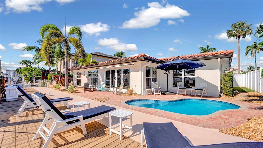 2524 Southeast 9th Street Pompano Beach, FL 33062 - Photo 41 of 45 a swimming pool with outdoor seating yard and patio