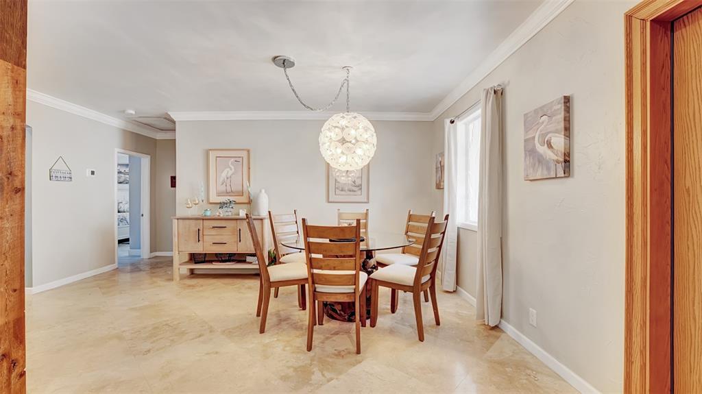 2524 Southeast 9th Street Pompano Beach, FL 33062 - Photo 43 of 45 a view of a dining room with furniture window and wooden floor