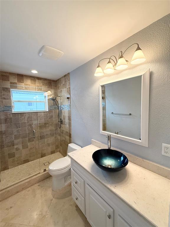 2524 Southeast 9th Street Pompano Beach, FL 33062 - Photo 44 of 45 a bathroom with a sink a toilet and mirror