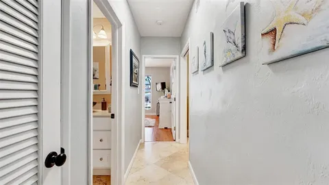a spacious bedroom with a bed and a cabinets