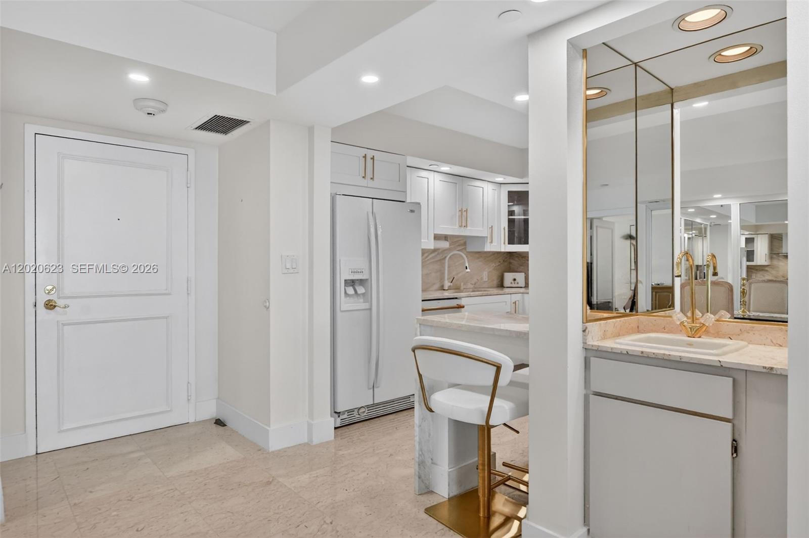4101 North Ocean Boulevard, Unit 1605 Boca Raton, FL 33431 - Photo 2 of 35 a room with a refrigerator and cabinets