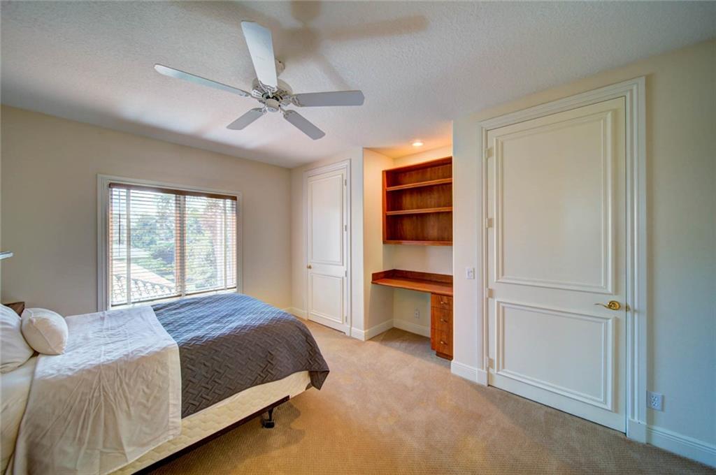 11 Island Road Stuart, FL 34996 - Photo 54 of 91 a bedroom with a bed and a cabinet