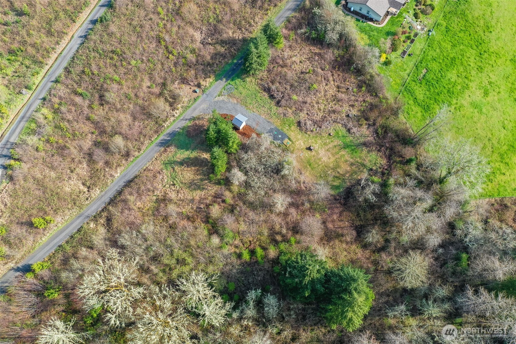 208 Sanderson Road Chehalis, WA 98532 - Photo 17 of 28 a view of a yard with plants and wooden fence