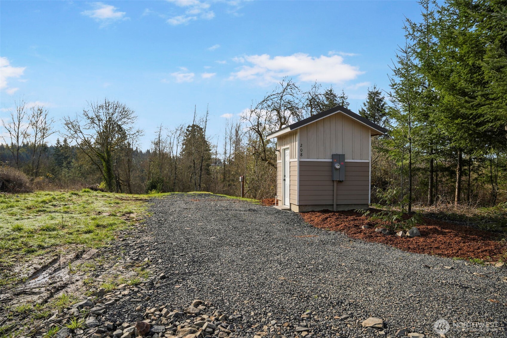 208 Sanderson Road Chehalis, WA 98532 - Photo 6 of 28 a view of a barn in the middle of a yard