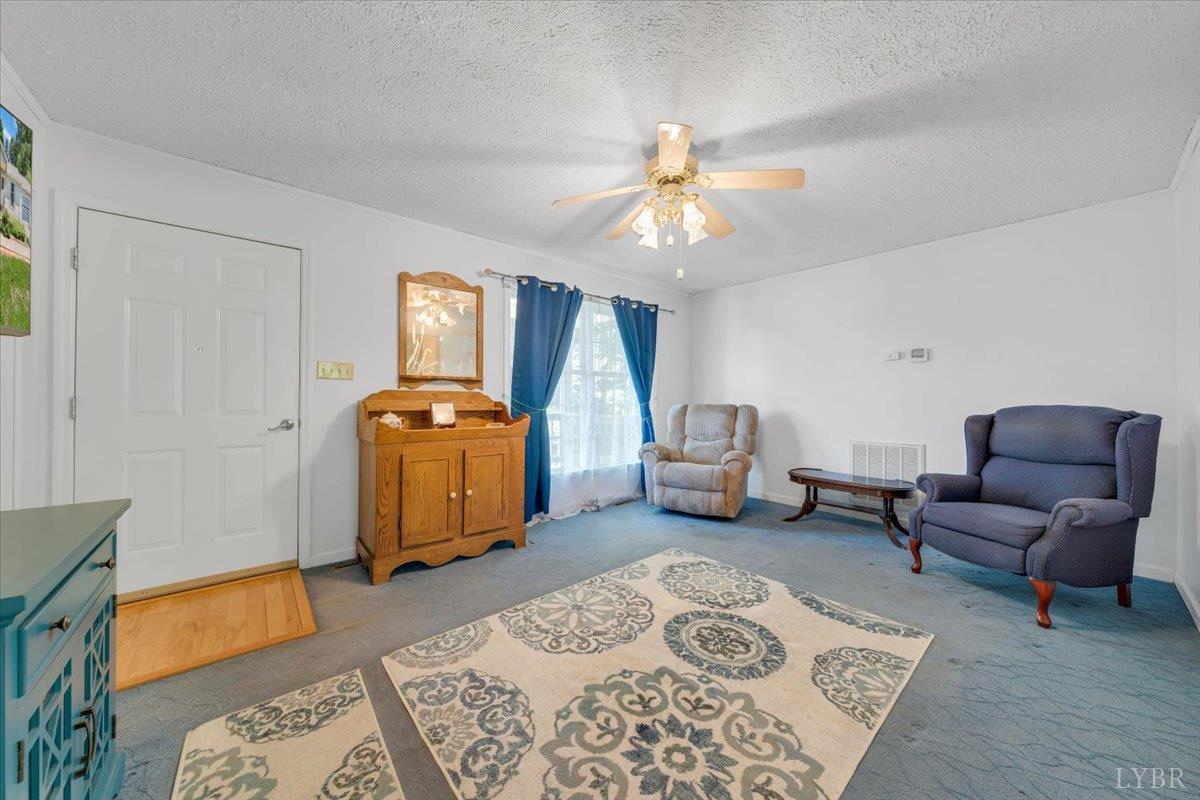1124 Homeplace Road Bedford, VA 24523 - Photo 6 of 47 a bedroom with furniture and a chandelier