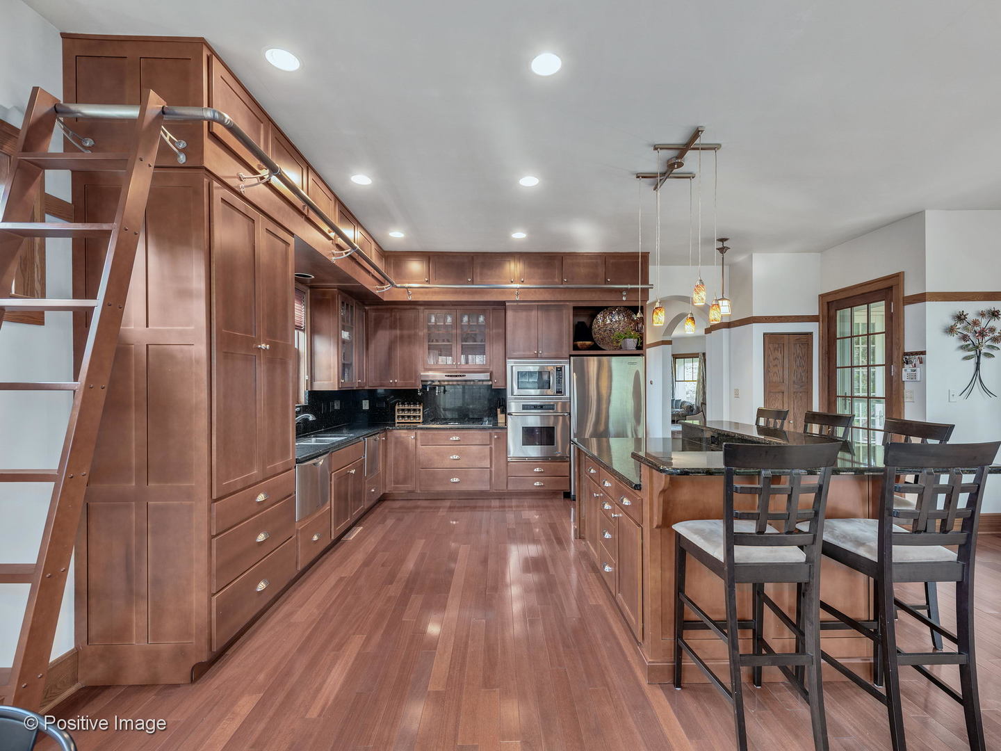 133 Scottswood Road Riverside, IL 60546 - Photo 14 of 38 a large kitchen with lots of counter space and stainless steel appliances
