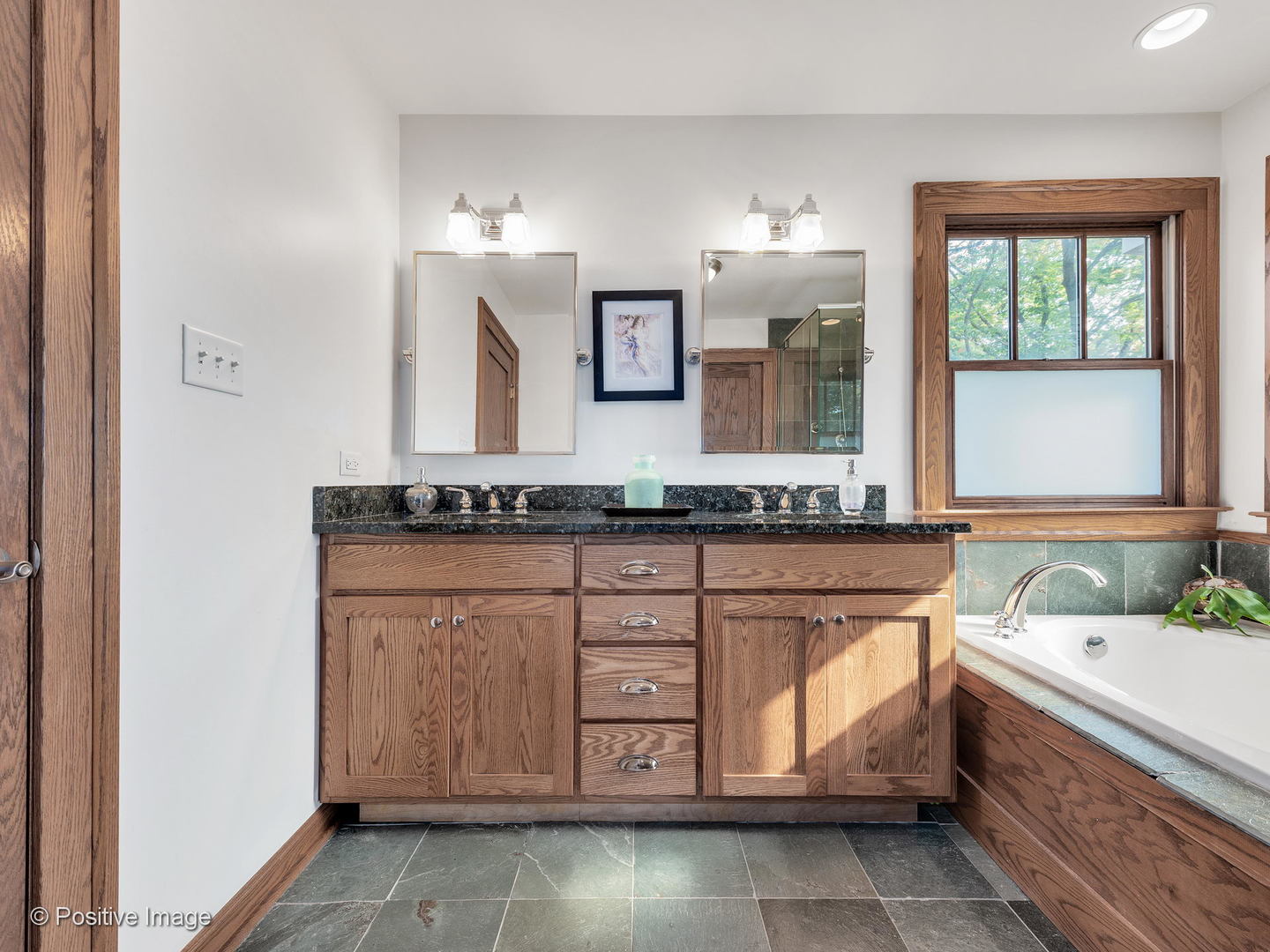133 Scottswood Road Riverside, IL 60546 - Photo 22 of 38 a bathroom with a bathtub and a sink