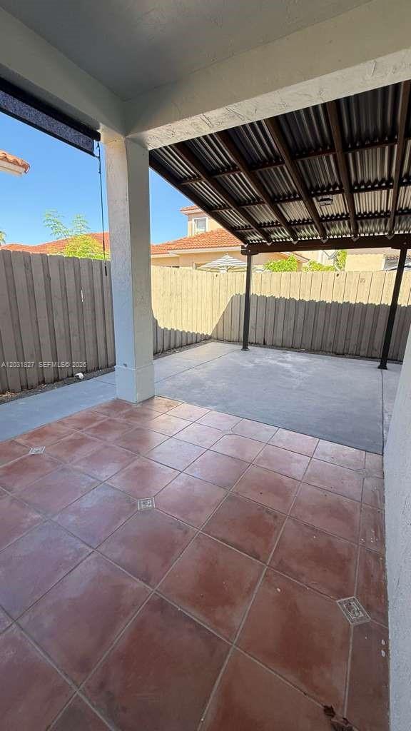 2120 Northeast 37th Road, Unit 1 Homestead, FL 33033 - Photo 29 of 30 a view of backyard with wooden floor and door