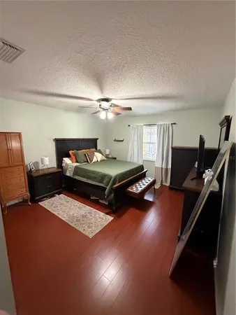 a living room with furniture pool table and a window