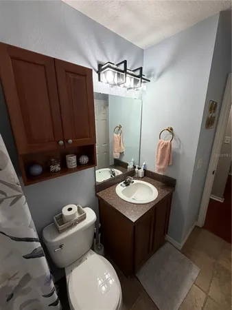 a bathroom with a sink and mirror