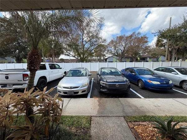 a couple of cars parked in a parking lot